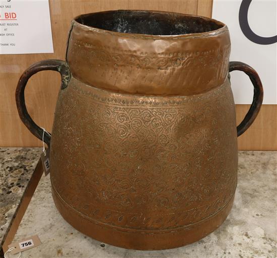 A large Eastern twin handled copper vessel W.60cm approx.